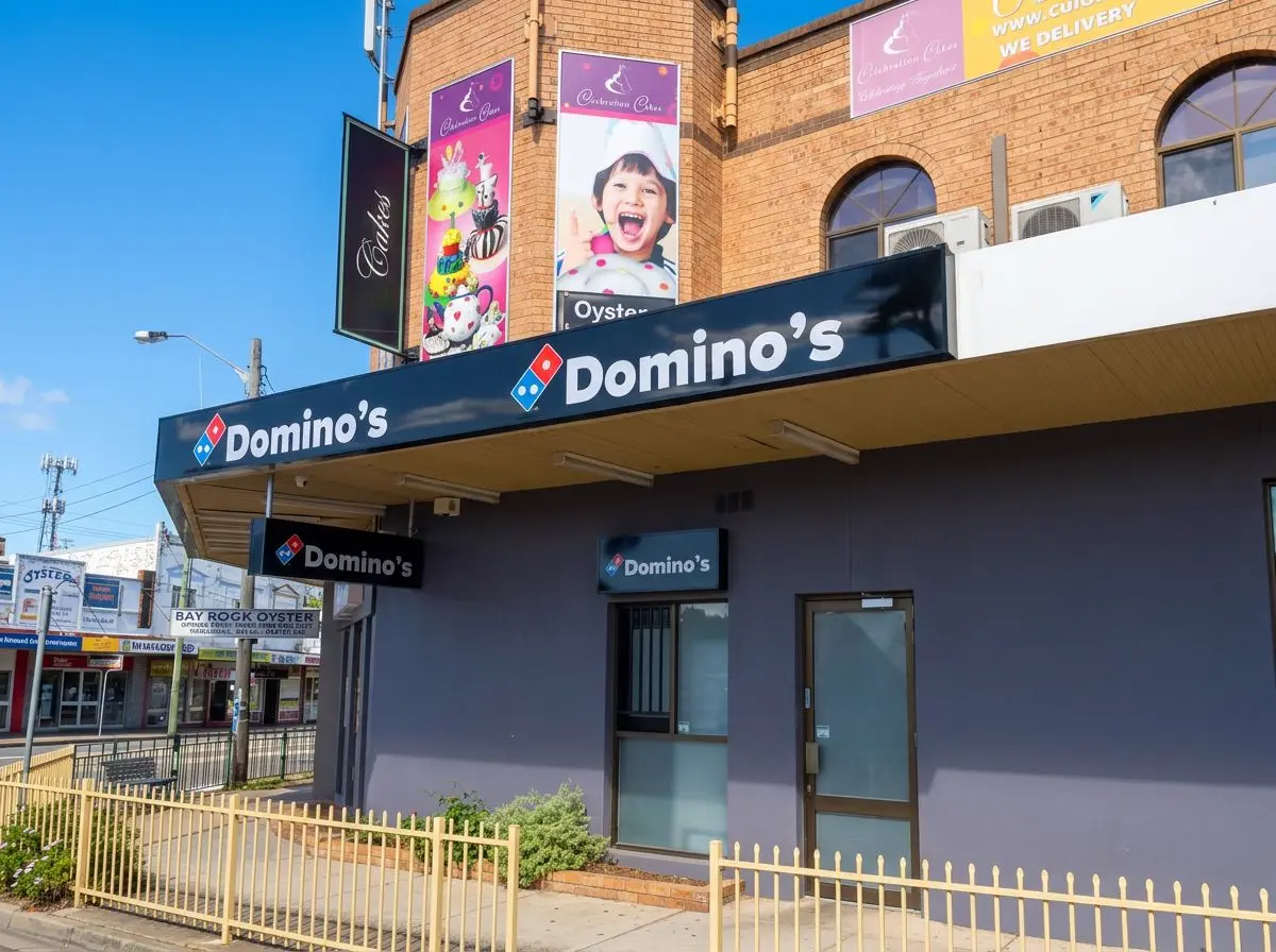 Domino's awning fascia signage and projecting lightbox signs